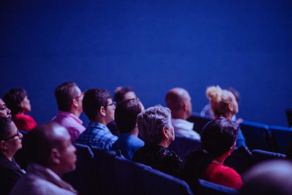 Photo by Luis Quintero: https://www.pexels.com/photo/people-sitting-on-gang-chairs-2774556/